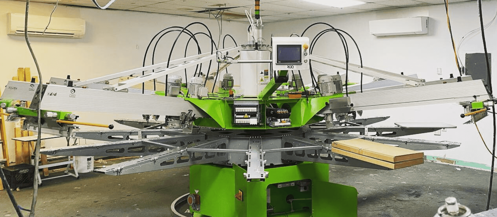 Large automatic screen printing machine, perfect for bulk screen print shirts and custom t-shirt production.